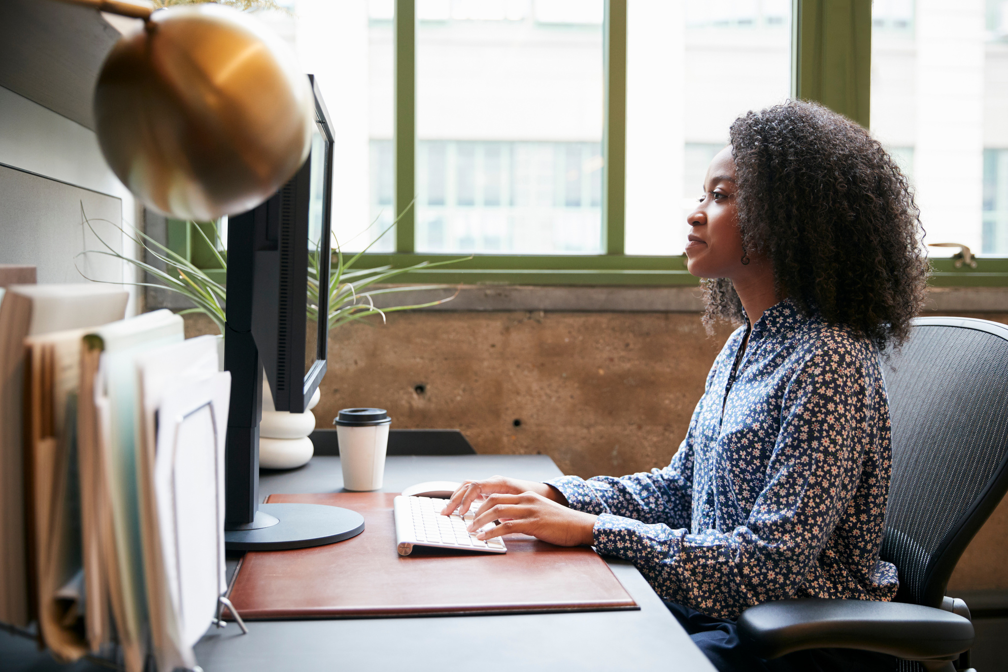 Black Woman Working at a Computer 